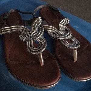Gently used silver sandals with tan bottoms